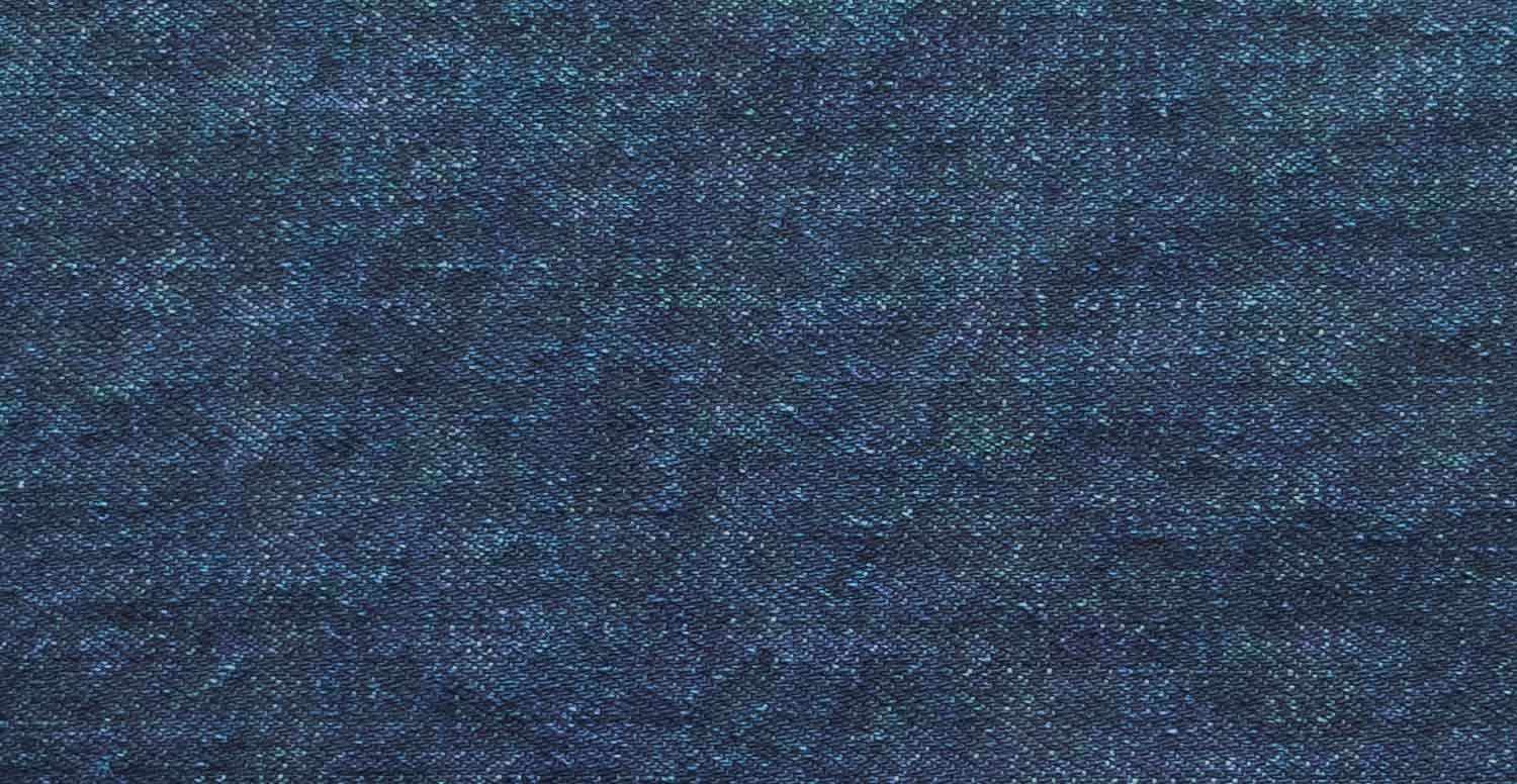 Comparison between a raw denim fabric before and after treatment with Garmon's denim fixing products