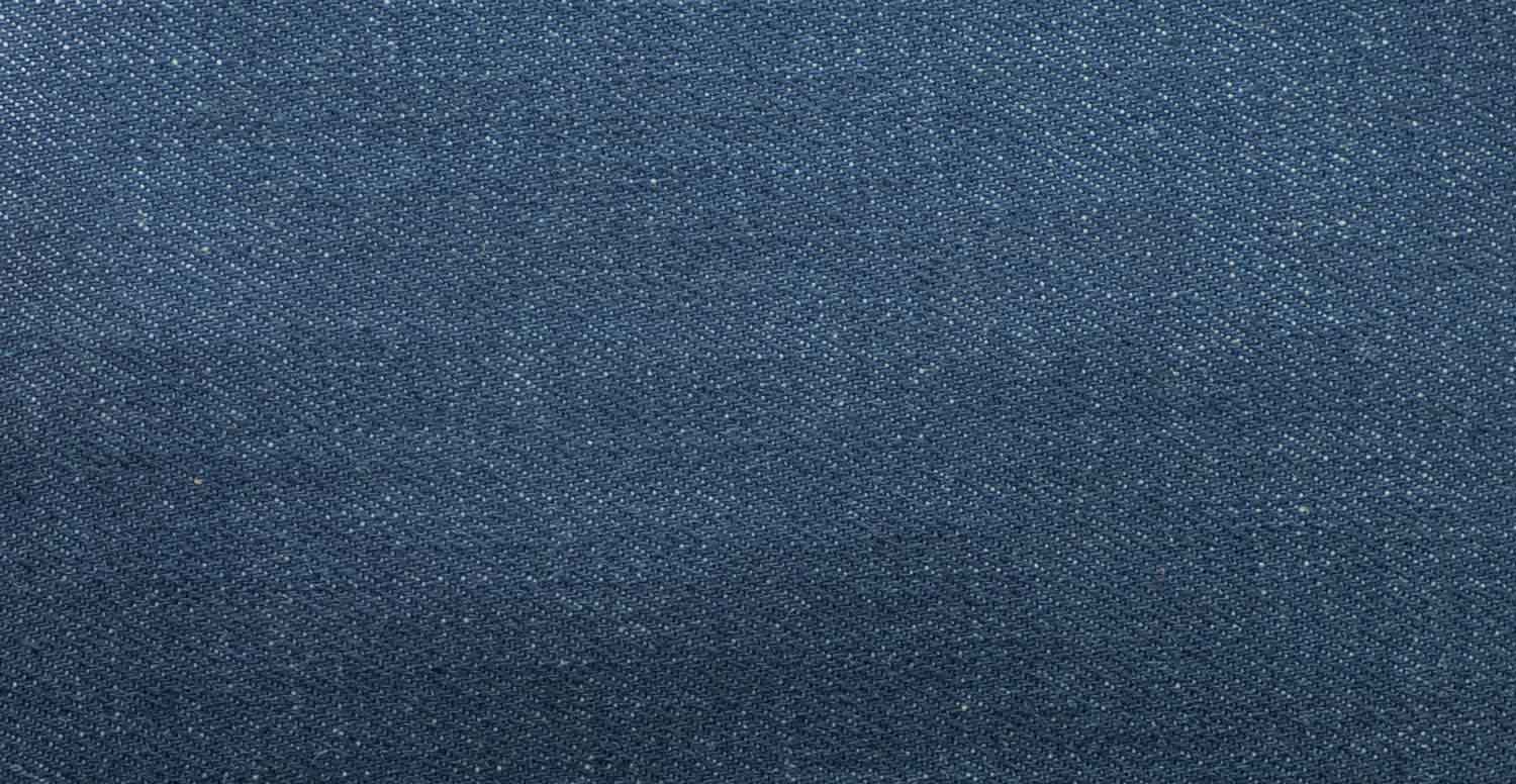 Comparison between a raw denim fabric before and after treatment with Garmon's desizing products