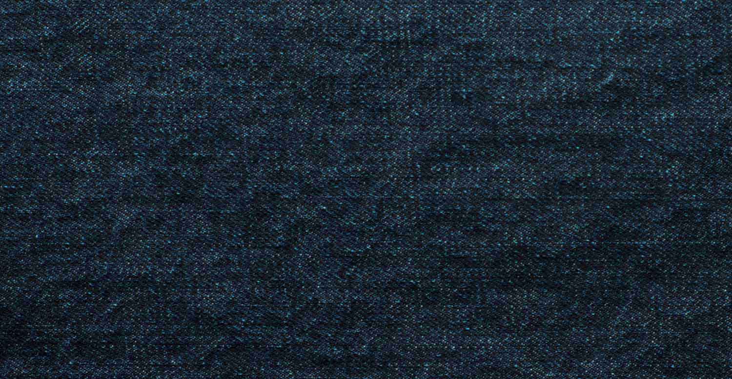 Comparison between a raw denim fabric before and after treatment with Garmon's desizing products