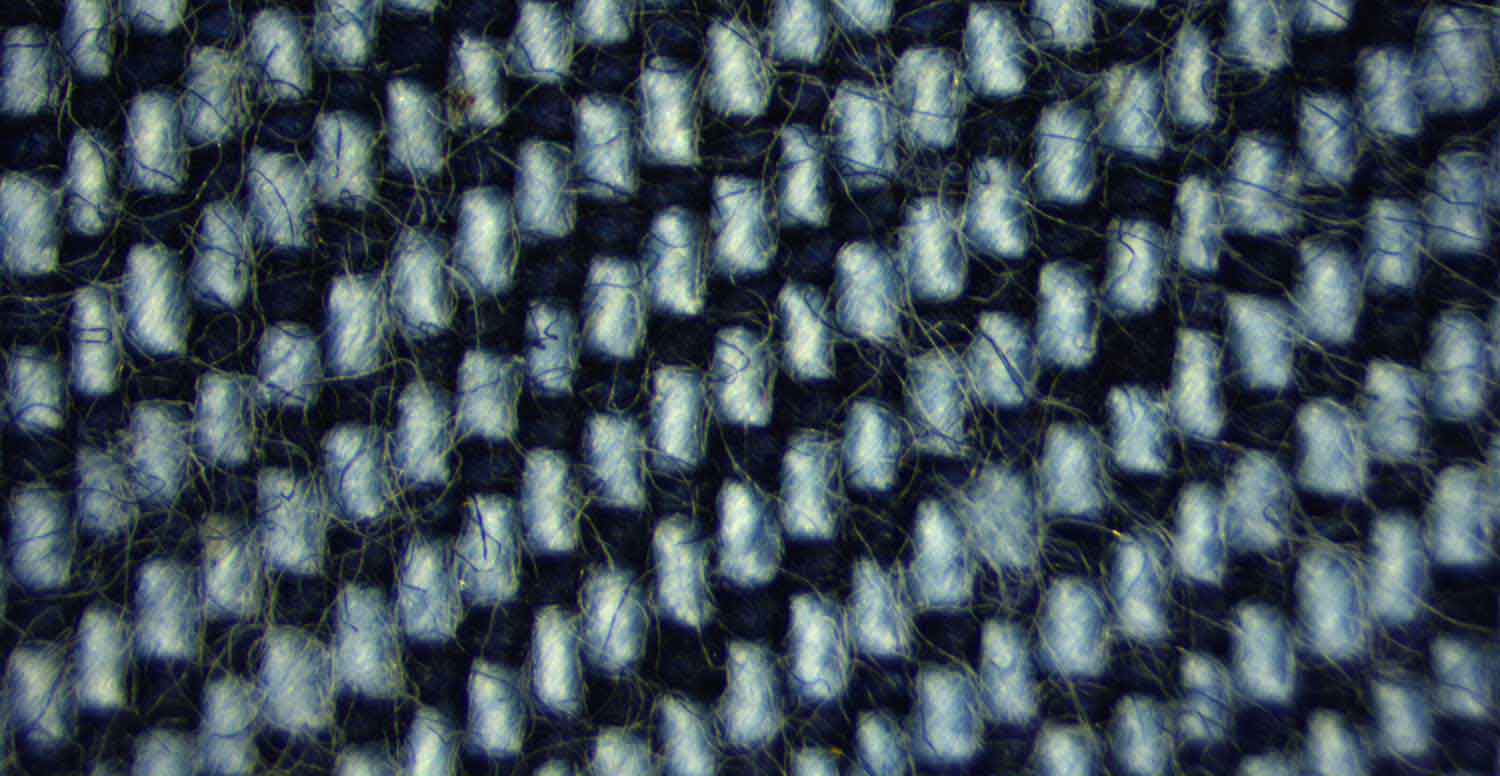 Comparison between a raw denim fabric before and after treatment with Garmon's special washing products